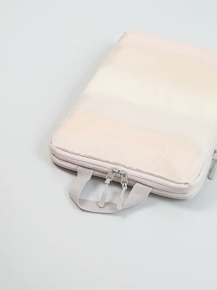 Frame at 50 seconds from the supplier video: closed beige organizer with its zip and handle visible; another listing variant.